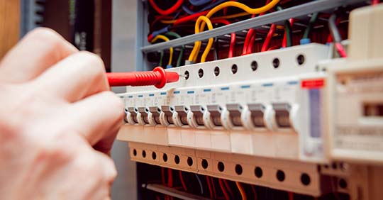 Electrician performing fault detection tests